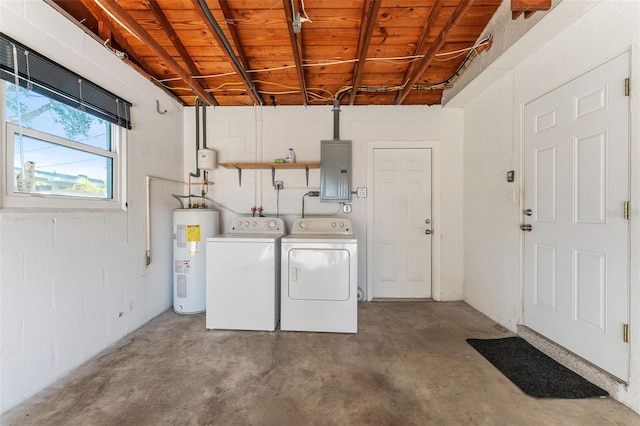 washroom featuring washer and dryer, concrete block wall, electric panel, and water heater