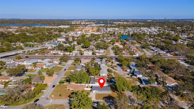 drone / aerial view featuring a water view and a residential view