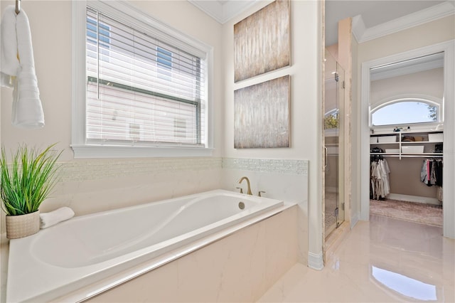 full bath with a garden tub, a spacious closet, a stall shower, and ornamental molding