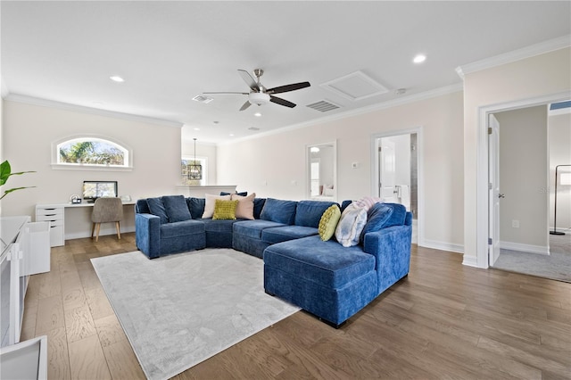 living area featuring ceiling fan, light wood-style flooring, visible vents, and ornamental molding