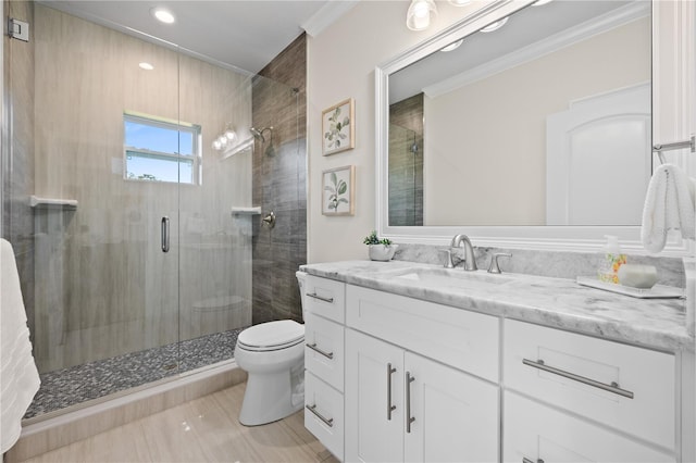 bathroom with vanity, a stall shower, tile patterned flooring, crown molding, and toilet