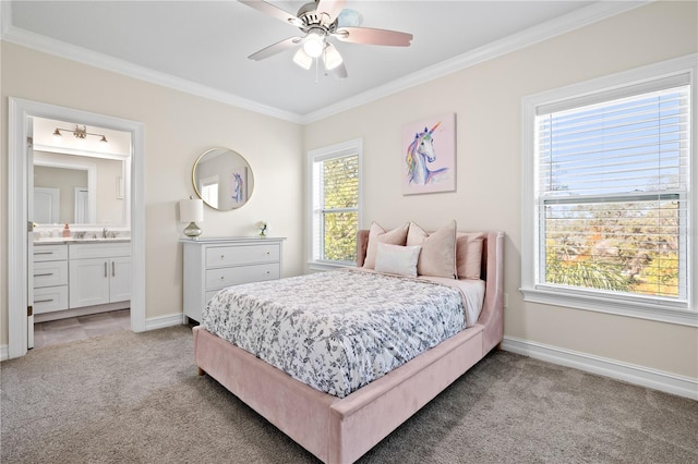 bedroom featuring crown molding, light colored carpet, and baseboards