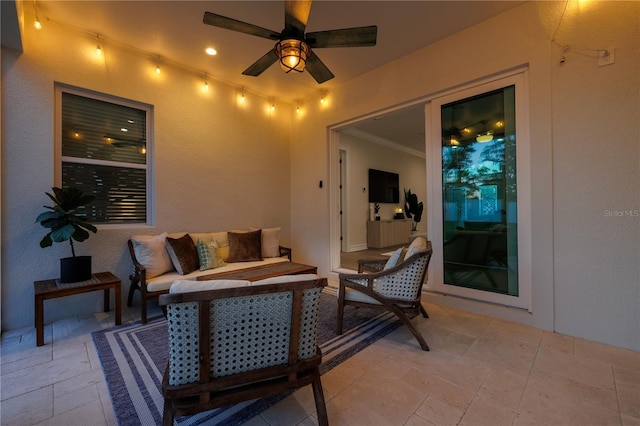 view of patio / terrace with an outdoor living space and ceiling fan