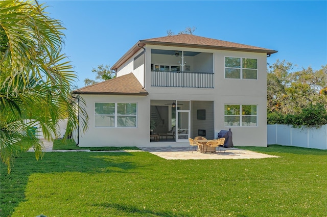 back of house featuring stucco siding, a patio, fence, a balcony, and ceiling fan