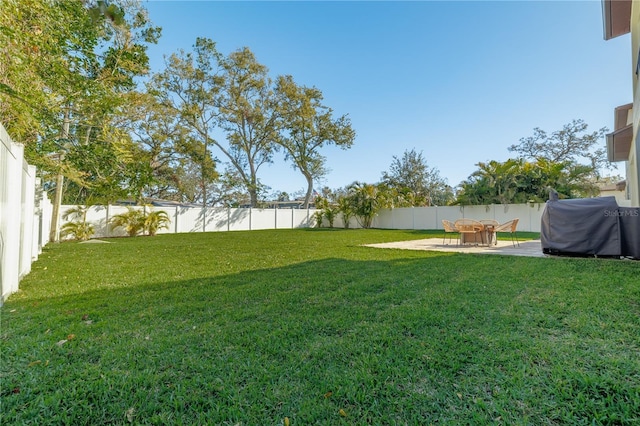 view of yard featuring a patio area and a fenced backyard