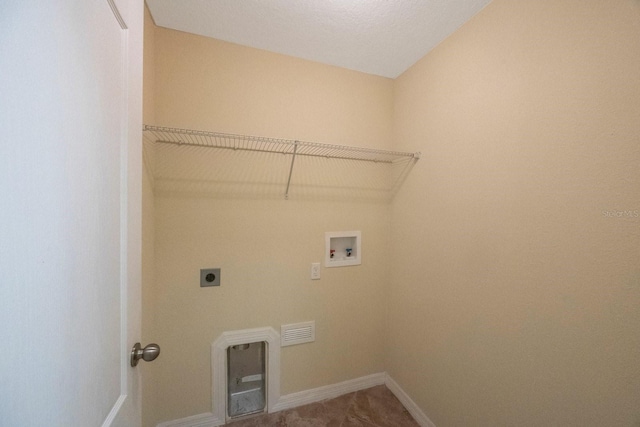 clothes washing area featuring baseboards, hookup for an electric dryer, washer hookup, and laundry area