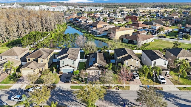 bird's eye view featuring a residential view and a water view