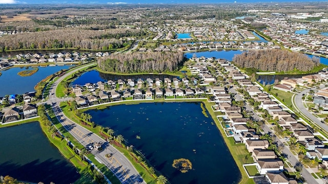 birds eye view of property featuring a residential view and a water view