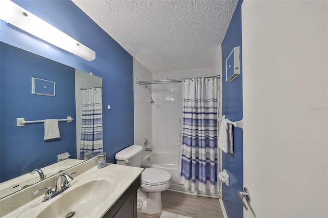 bathroom featuring vanity, shower / bathtub combination with curtain, wood finished floors, a textured ceiling, and toilet