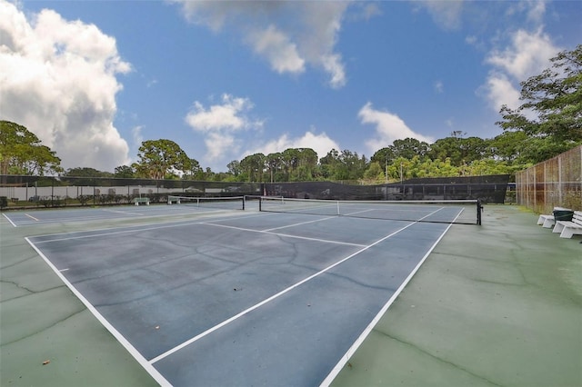 view of sport court with fence