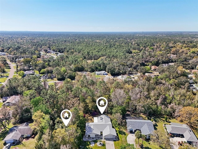 aerial view featuring a view of trees