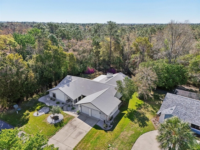 bird's eye view featuring a forest view