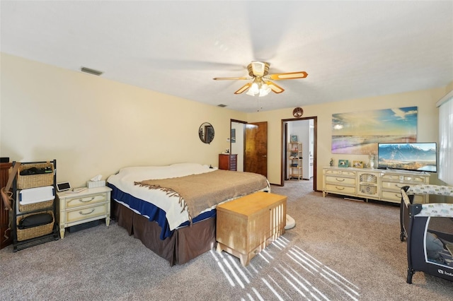 bedroom with visible vents, carpet floors, and ceiling fan