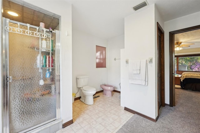 bathroom featuring a bidet, baseboards, visible vents, a stall shower, and toilet