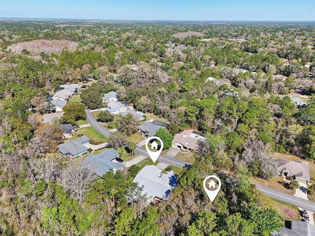 aerial view with a residential view and a view of trees