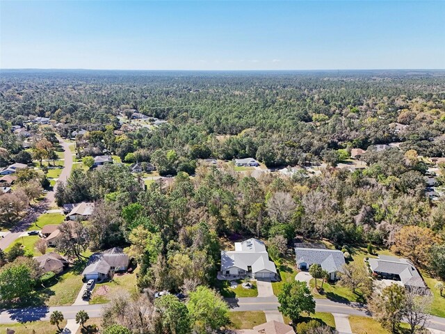 aerial view with a residential view and a wooded view