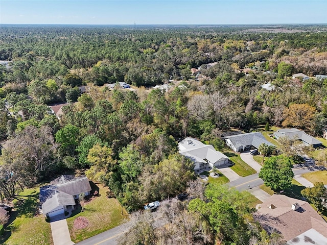 birds eye view of property with a forest view