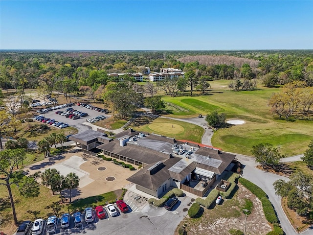 birds eye view of property featuring a view of trees and view of golf course