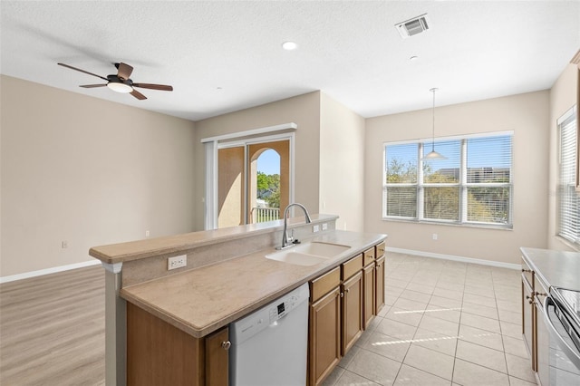 kitchen featuring visible vents, electric range, white dishwasher, ceiling fan, and a sink