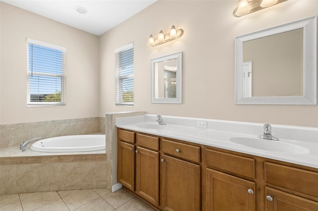 bathroom with a sink, a garden tub, double vanity, and tile patterned floors