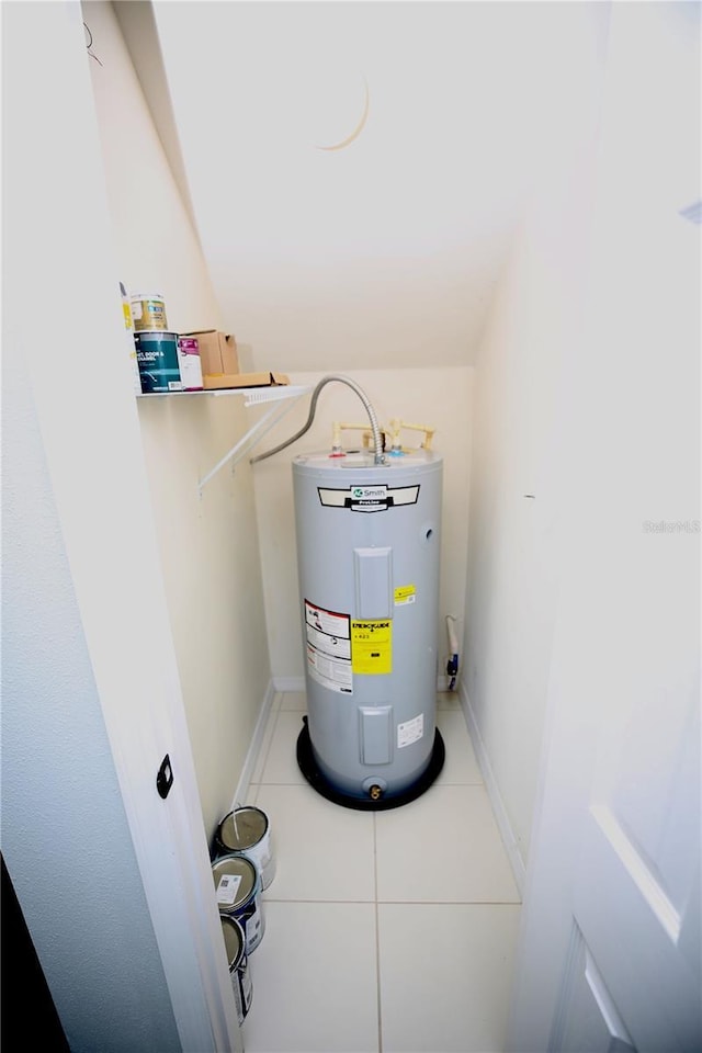 utility room with electric water heater