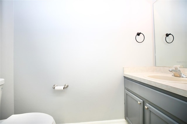 half bath with vanity and toilet