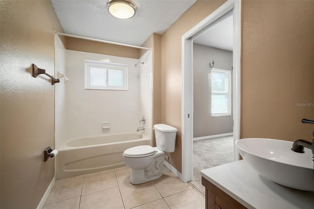 full bathroom featuring vanity, tile patterned flooring, toilet, and a wealth of natural light