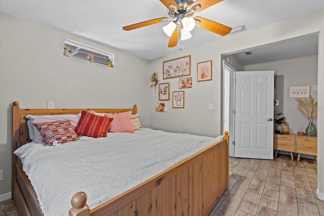 bedroom with ceiling fan and light wood finished floors