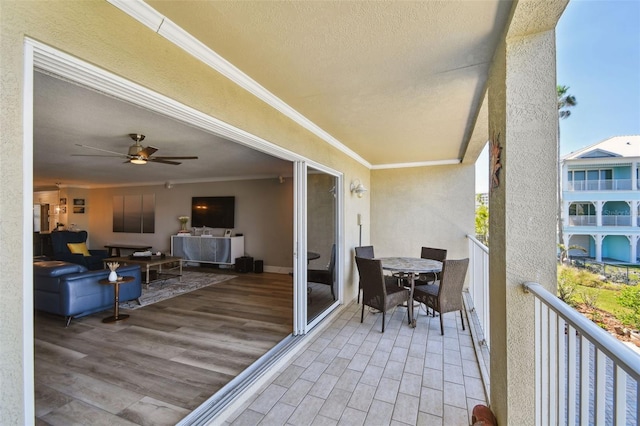 exterior space featuring ceiling fan