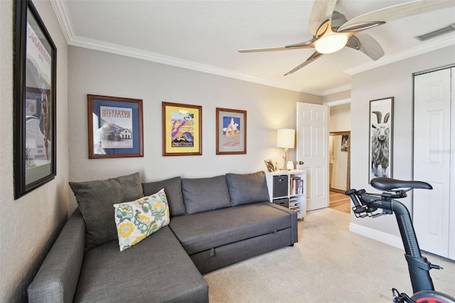 interior space featuring light carpet, visible vents, ceiling fan, and ornamental molding