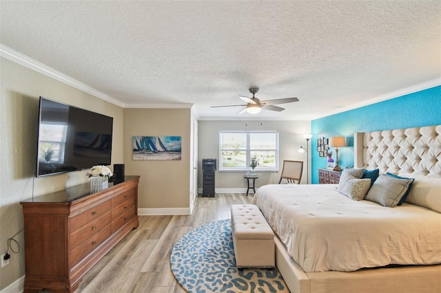 bedroom featuring a textured ceiling, baseboards, light wood-type flooring, and ornamental molding