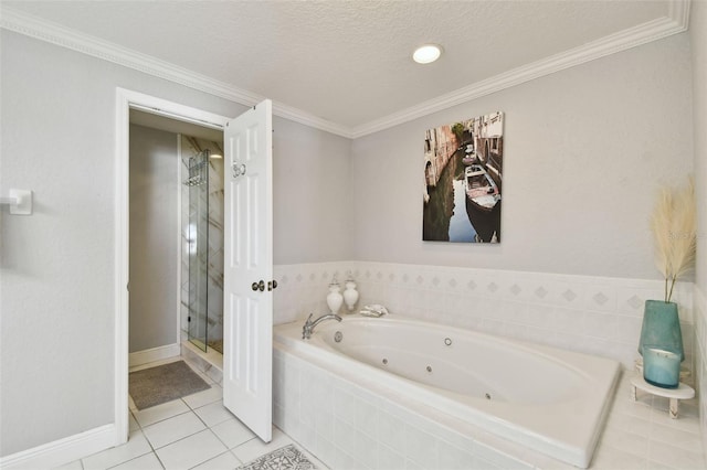 full bath with a tub with jets, ornamental molding, a shower stall, a textured ceiling, and tile patterned floors