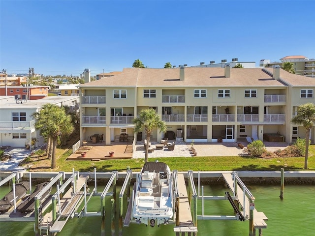 view of dock featuring a patio and boat lift