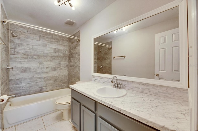 bathroom with vanity, visible vents, shower / bath combination, tile patterned floors, and toilet