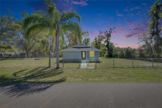 view of front of home featuring a yard and a fenced front yard