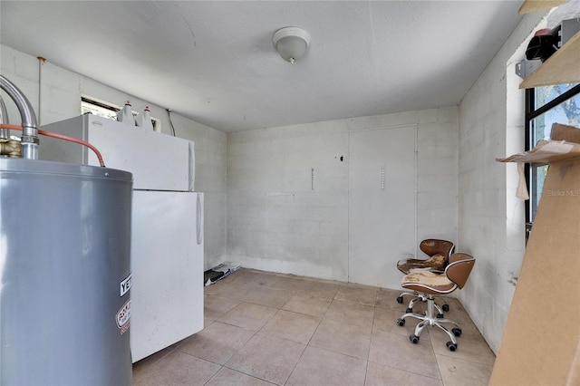 interior space featuring tile patterned flooring and gas water heater