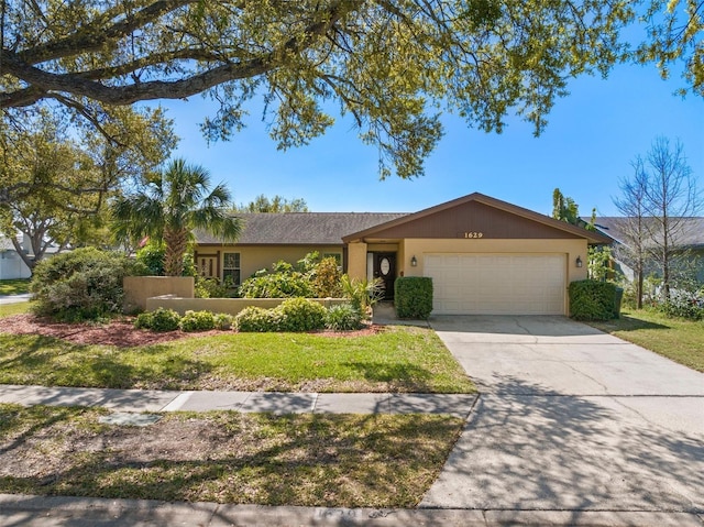 ranch-style home with stucco siding, concrete driveway, and an attached garage