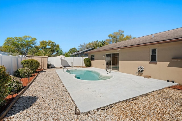 view of pool with a patio area and a fenced backyard