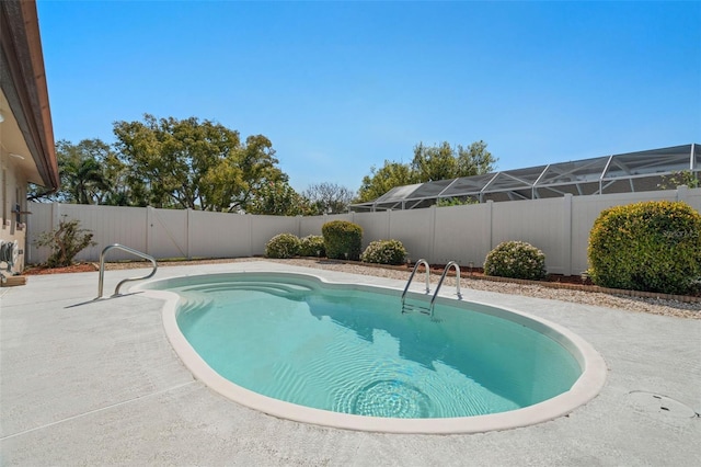 view of swimming pool featuring a patio area and a fenced backyard