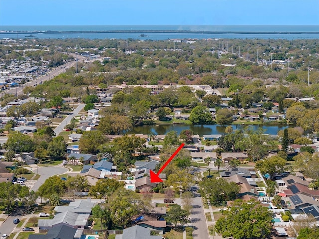 birds eye view of property featuring a residential view and a water view