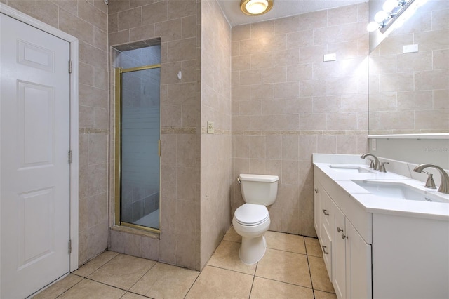 bathroom featuring a sink, a stall shower, and tile patterned floors