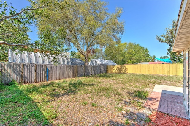 view of yard with a fenced backyard