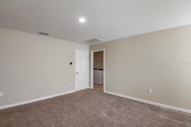 unfurnished room featuring carpet flooring, baseboards, visible vents, and a textured ceiling