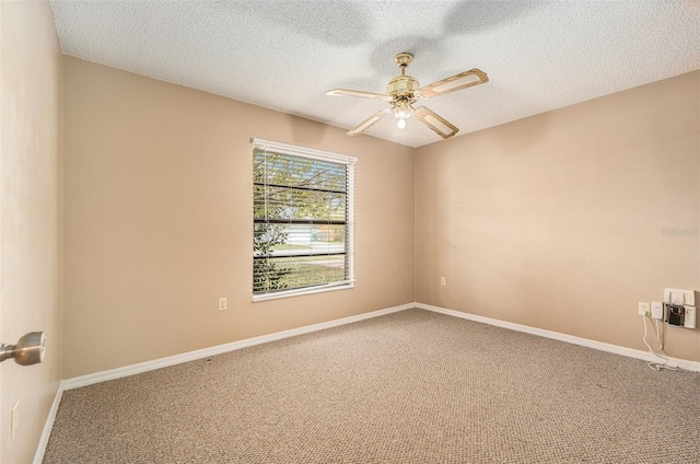 unfurnished room with a textured ceiling, baseboards, carpet, and a ceiling fan