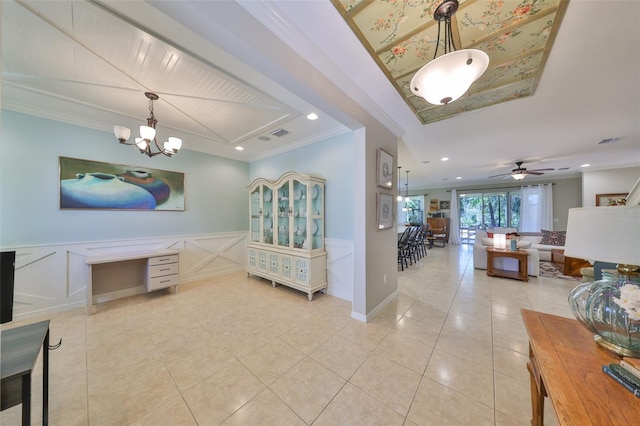 hallway featuring light tile patterned flooring, crown molding, and a decorative wall