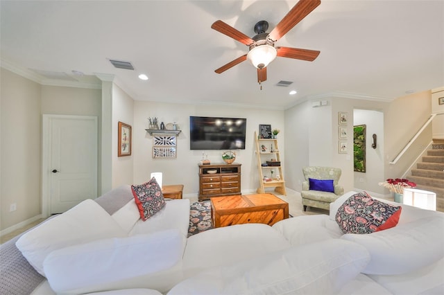 living room featuring stairs, crown molding, and visible vents