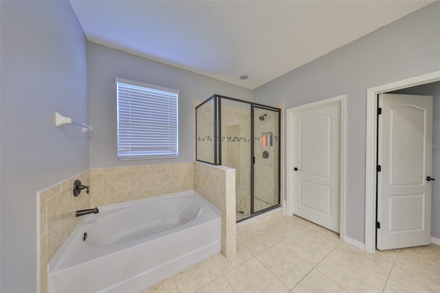 full bath with a shower stall, a bath, and tile patterned floors