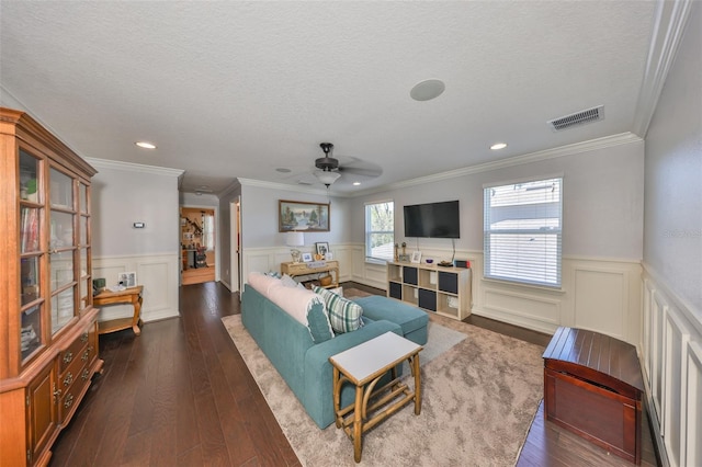 living area featuring visible vents, a textured ceiling, ceiling fan, and dark wood-style flooring