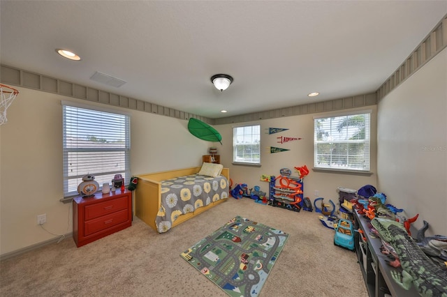 carpeted bedroom featuring recessed lighting and visible vents