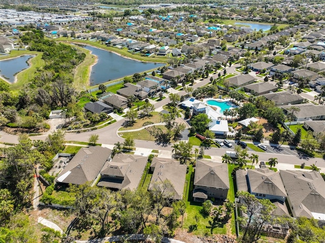 aerial view featuring a residential view and a water view